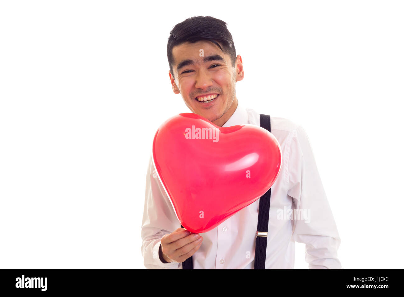 Giovane con bow tie-holding palloncino Foto Stock