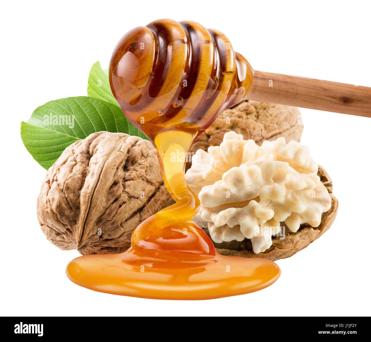 Miele di gocciolamento di noci isolato su uno sfondo bianco. Foto Stock