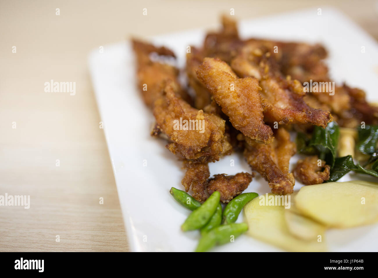 Sour fritto di ali di pollo Foto Stock