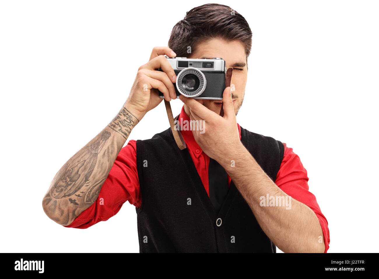 Tatuato uomo con una fotocamera retrò isolati su sfondo bianco Foto Stock