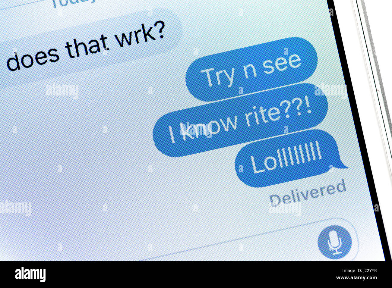 Un messaggio di testo visualizzati sullo schermo di iPhone (LOL messaggio di testo, comune texting slang) - USA Foto Stock