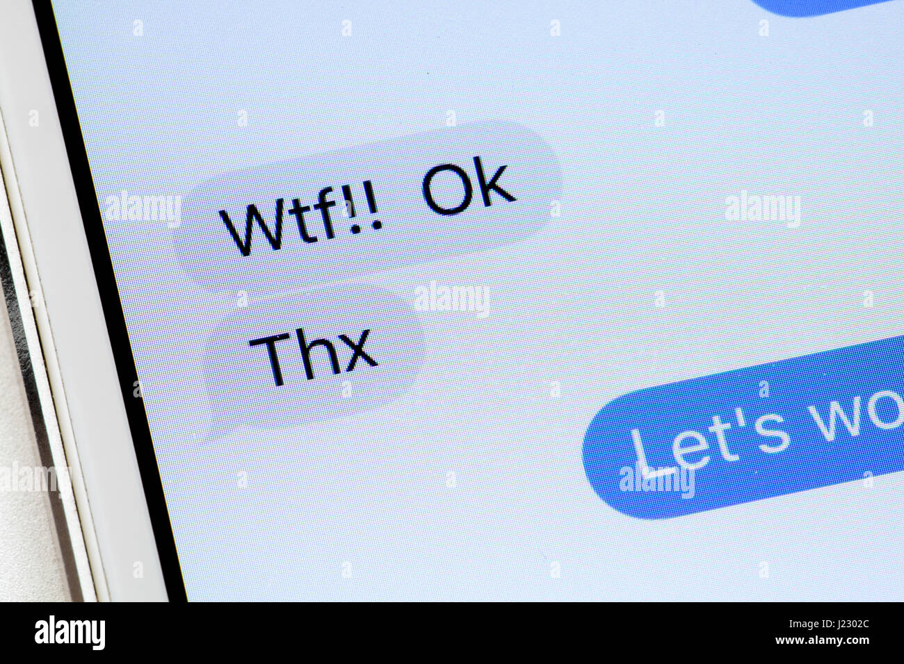 Un messaggio di testo visualizzati sullo schermo di iPhone (WTF testo, Thx testo) - USA Foto Stock
