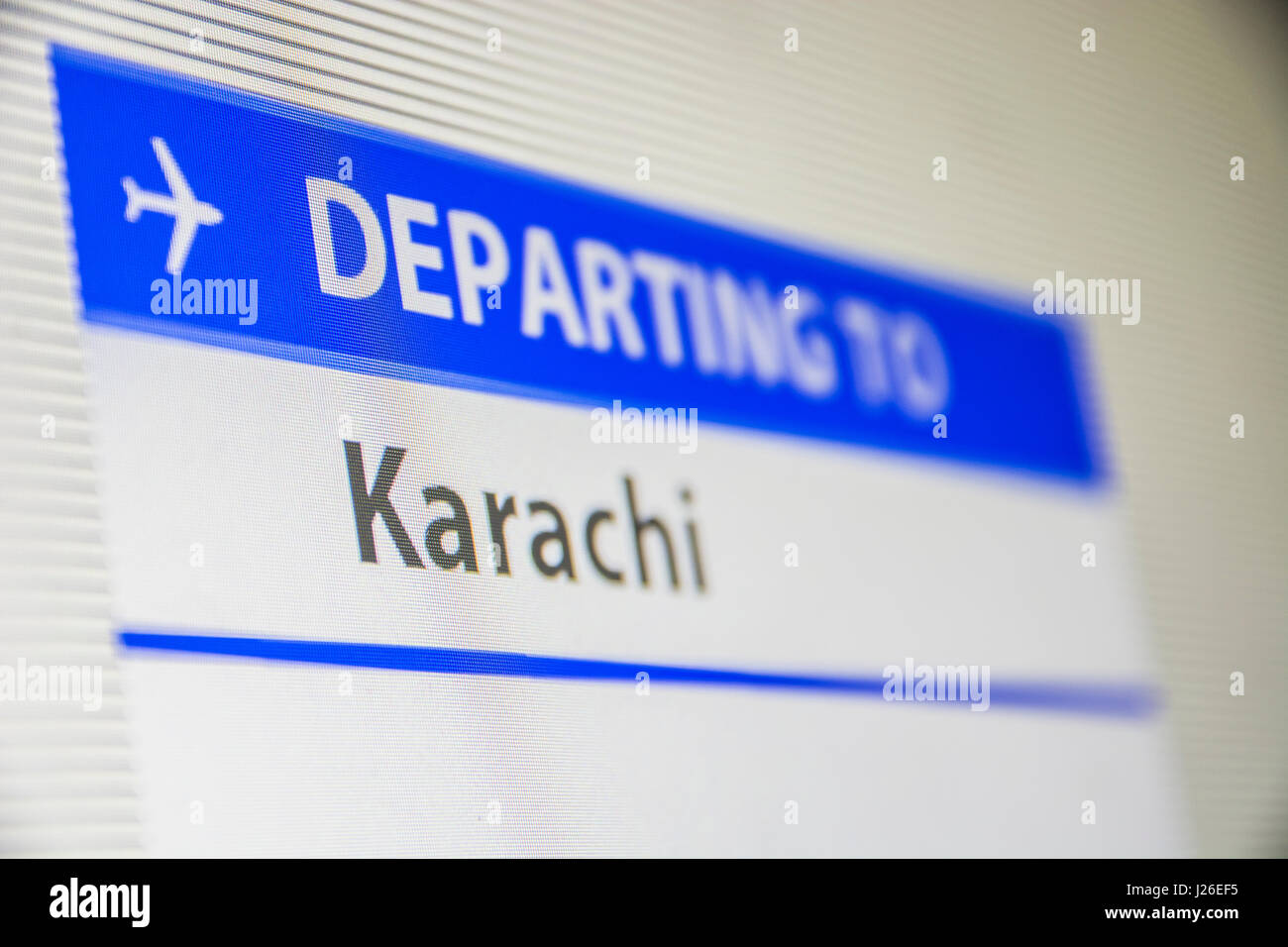 Sullo schermo del computer di close-up di stato del volo in partenza a Karachi, Pakistan Foto Stock