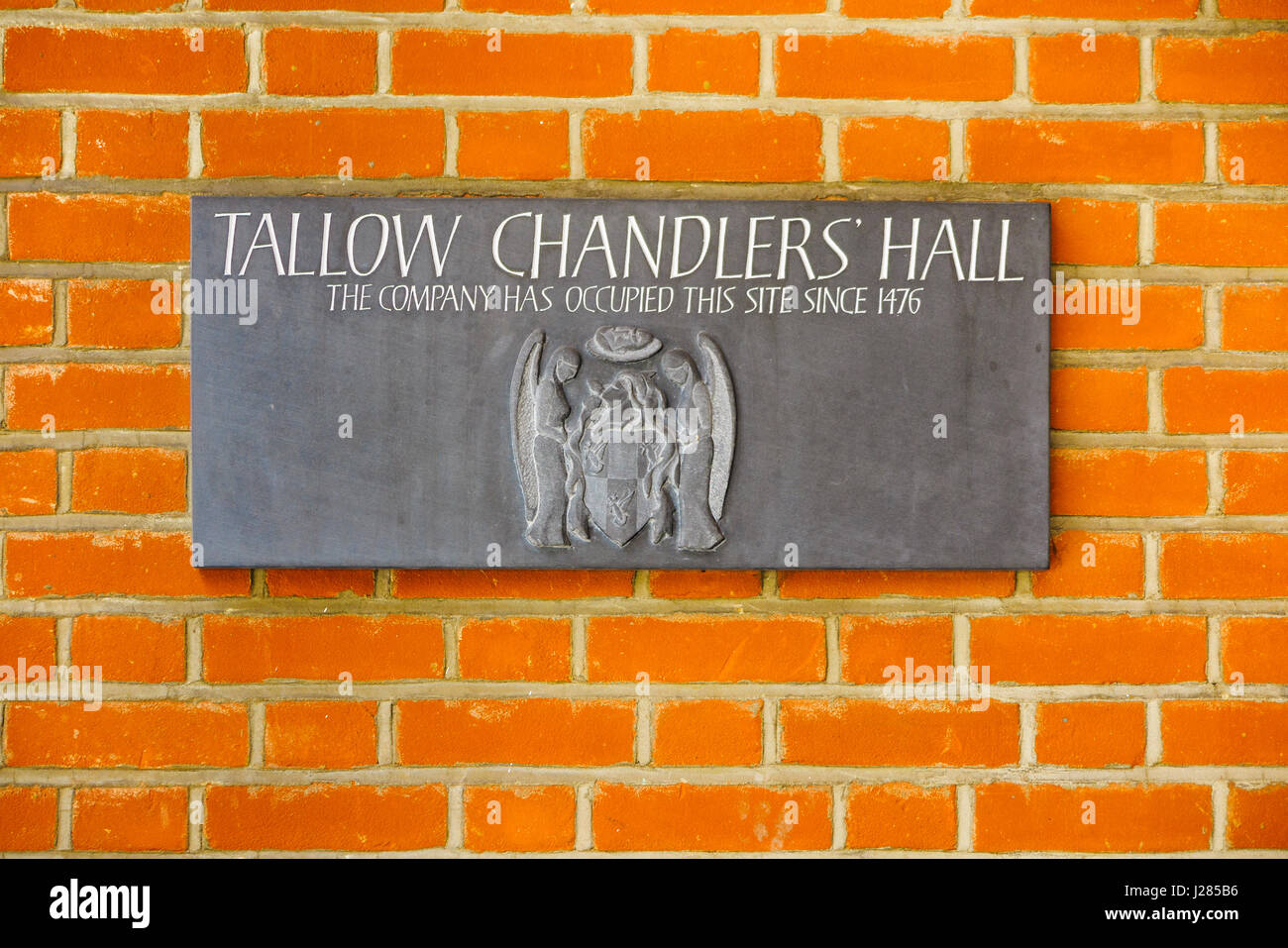 Nome sign sulla parete della sede della Venerabile compagnia di sego Chandlers (sego Chandlers Company), Dowgate Hill, London EC4 Foto Stock