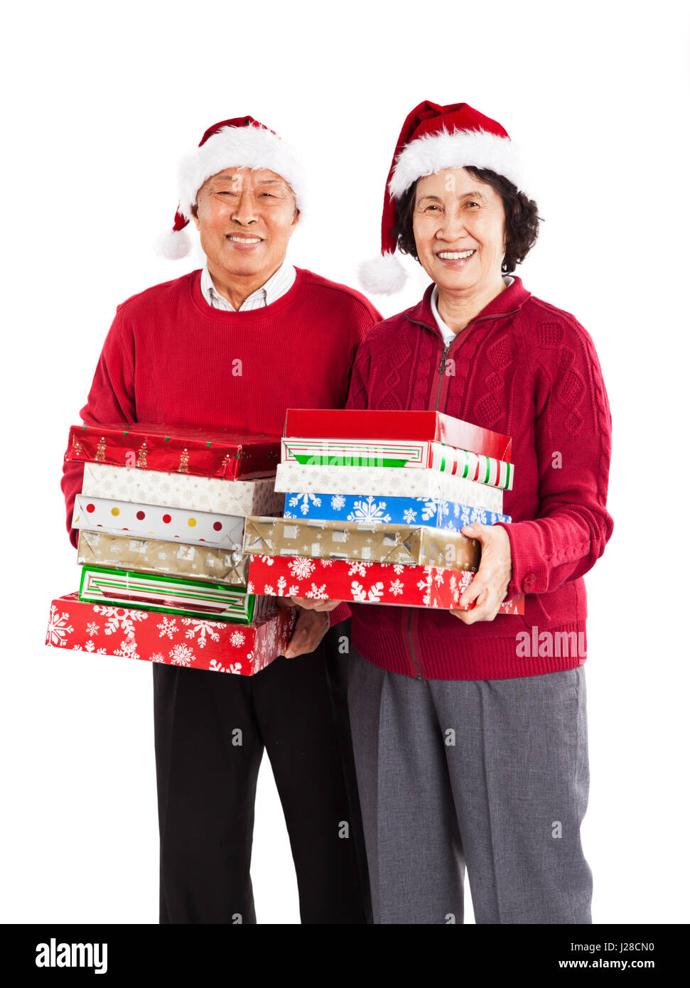 Un colpo di senior coppia asiatica che porta regali di Natale festeggiano il Natale Foto Stock