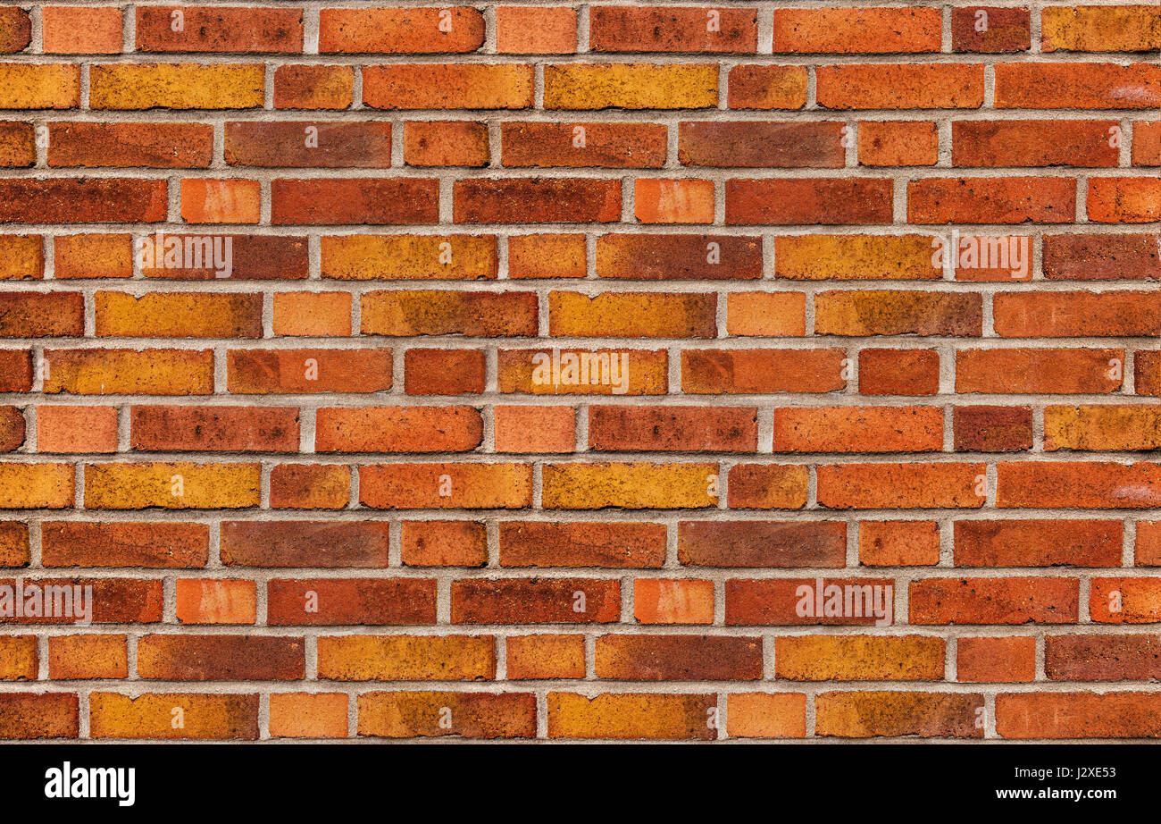 Bellissimo muro di mattoni, facciata di edificio come superficie di fondo urbano Foto Stock