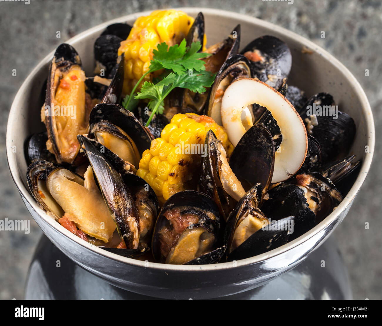 Cozze al curry salsa alla panna Foto Stock