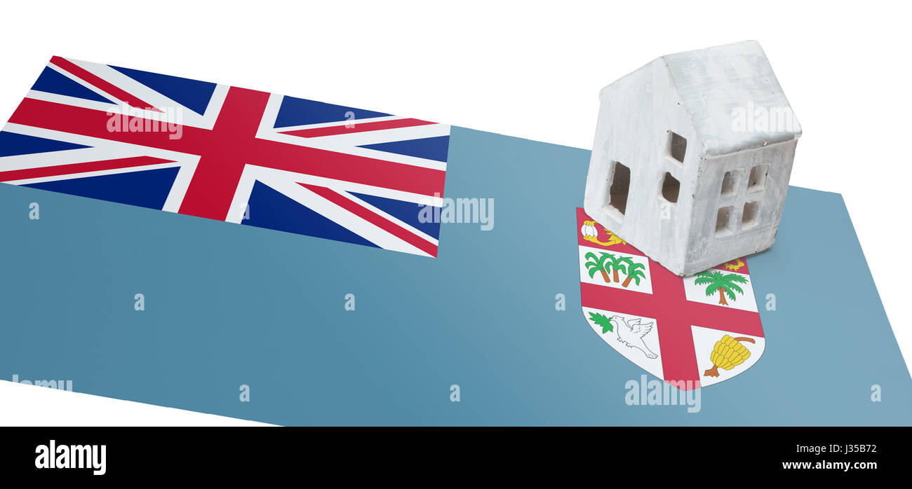 Piccola casa su una bandiera - vivere o la migrazione verso le isole Figi Foto Stock