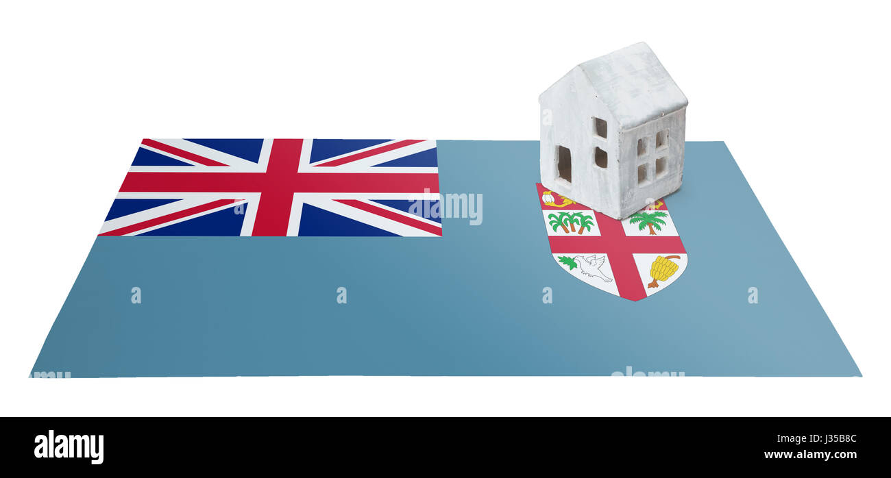 Piccola casa su una bandiera - vivere o la migrazione verso le isole Figi Foto Stock