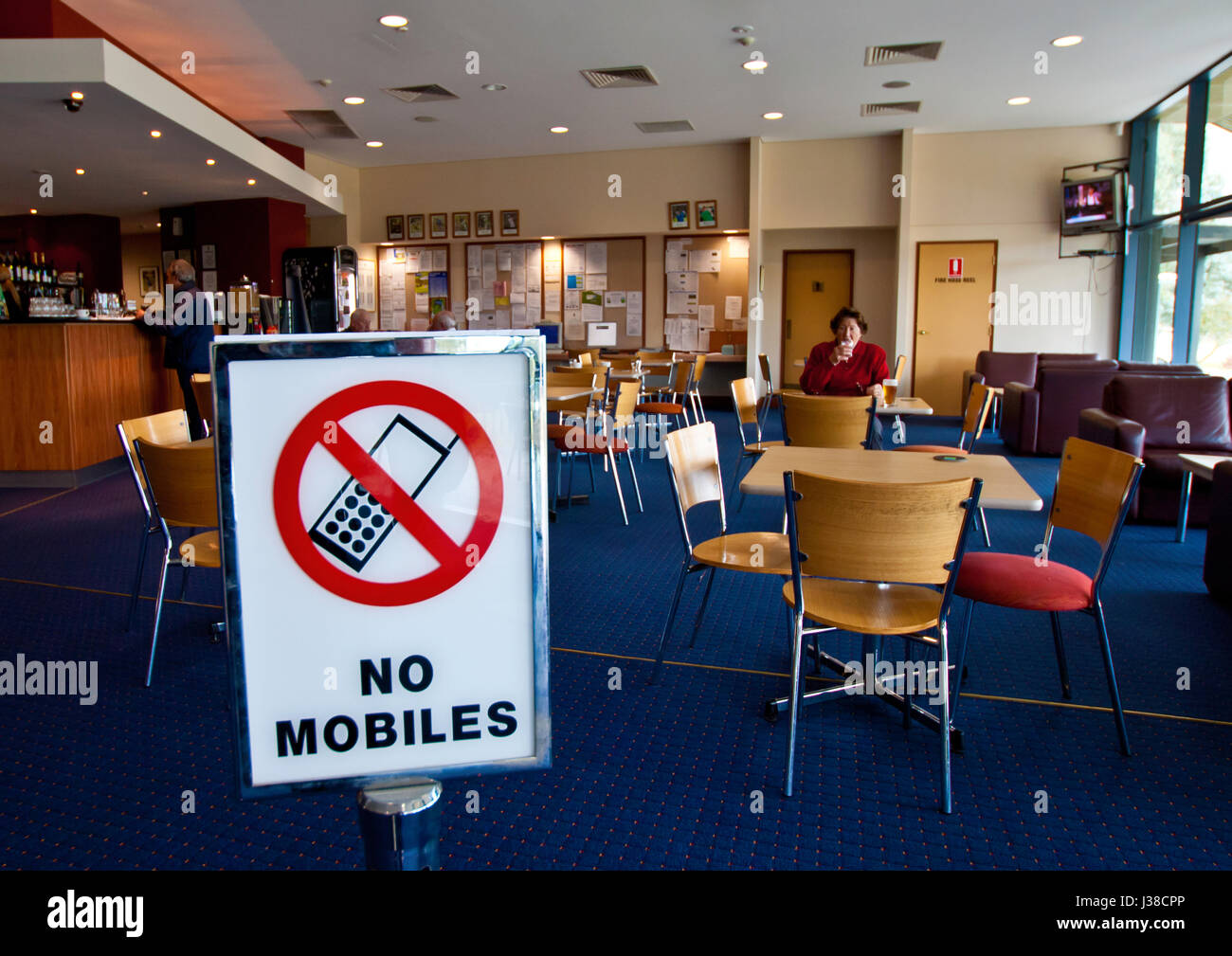 Uso di telefoni cellulari vietati nella clubhouse Foto Stock