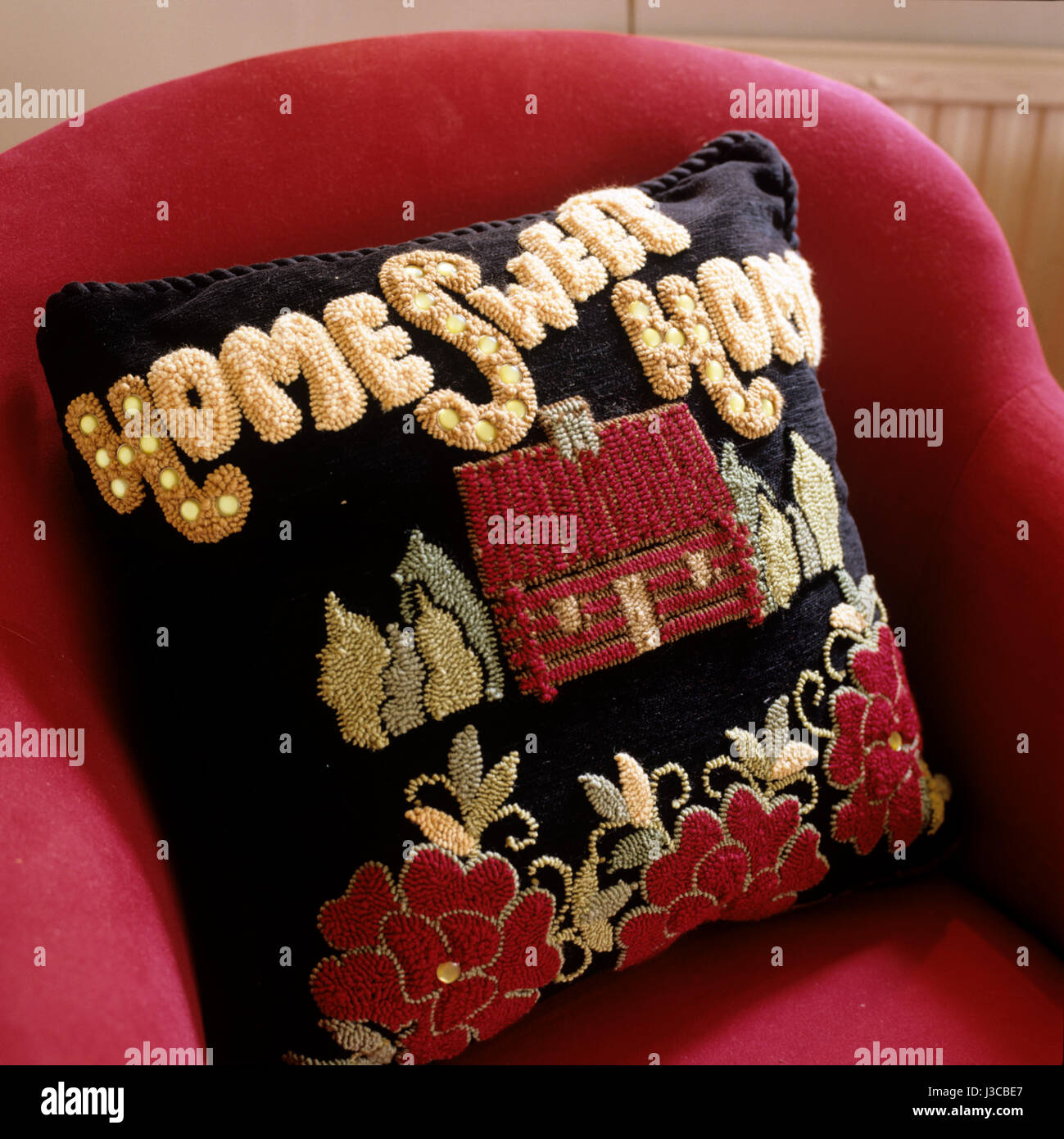 Un "home sweet home " cuscino disegnato da Judi l'espressione "boisson Foto Stock