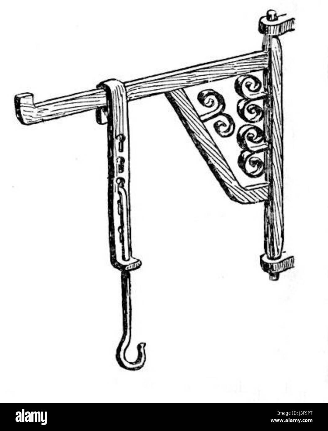 Una gru per camino è un dispositivo metallico utilizzato per regolare pentole e attrezzi da cucina su un fuoco in un focolare. Questi dispositivi erano comuni nelle case storiche per cucinare. Foto Stock
