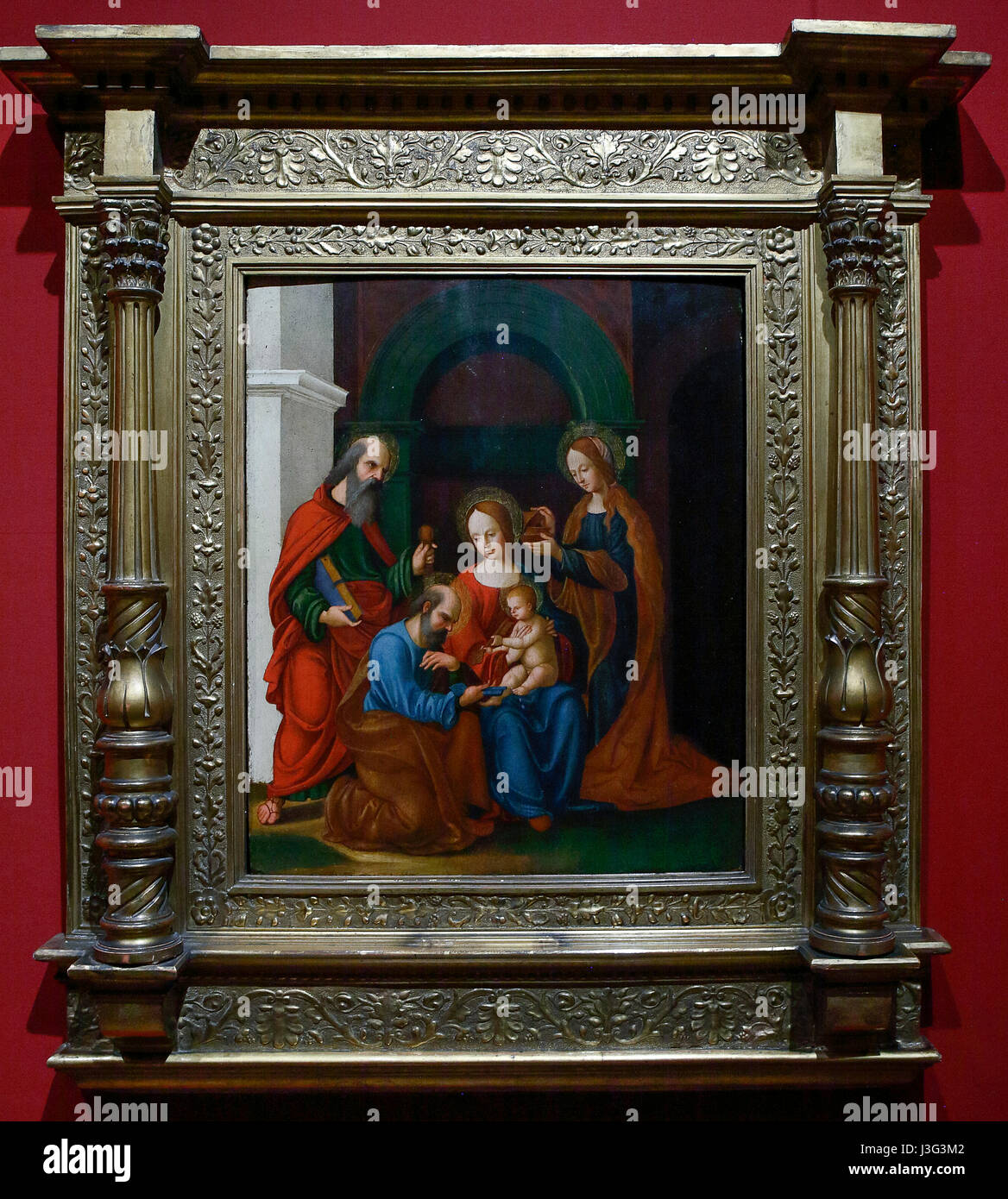 Urbino: Mostra Rinascimento segreto: Madonna con il Bambino e i santi Pietro e Paolo e Maria Maddalena. Ludovico Mazzolino 1515 Foto Stock