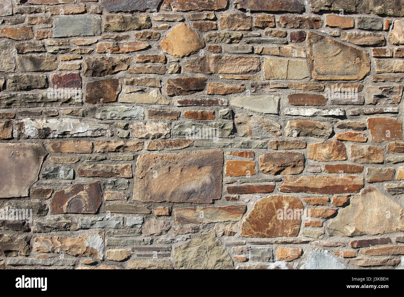 Muro di pietra naturale per uso in background Foto Stock