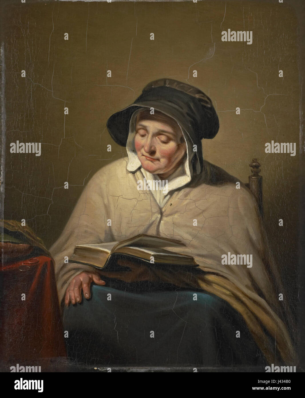 Lezende oude vrouw, tradotto come "donna anziana in lettura", è un'opera d'arte ospitata nel Rijksmuseum. Raffigura una donna anziana impegnata nella lettura, che riflette temi dell'invecchiamento e della tranquilla introspezione nell'arte. Foto Stock