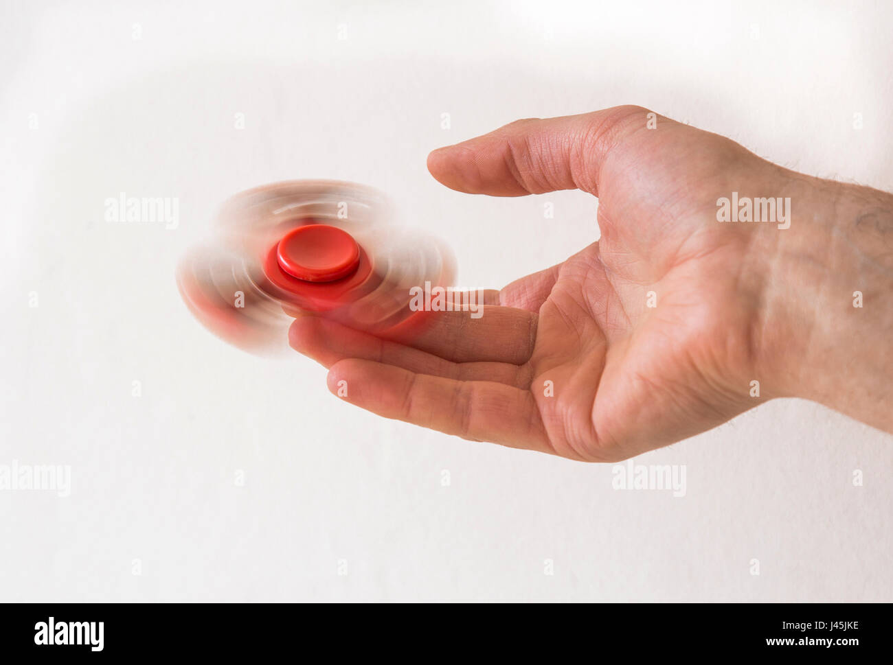 Mano spinner agitano: dito filatura giocattolo su un dito Foto Stock