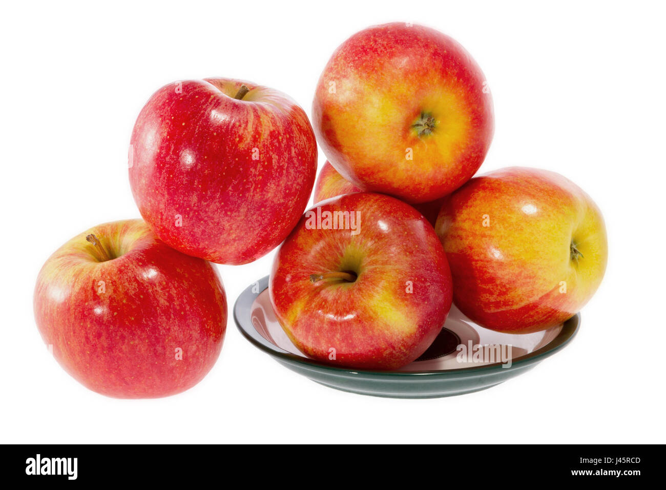 Un mature mele rosse su una piastra Foto Stock