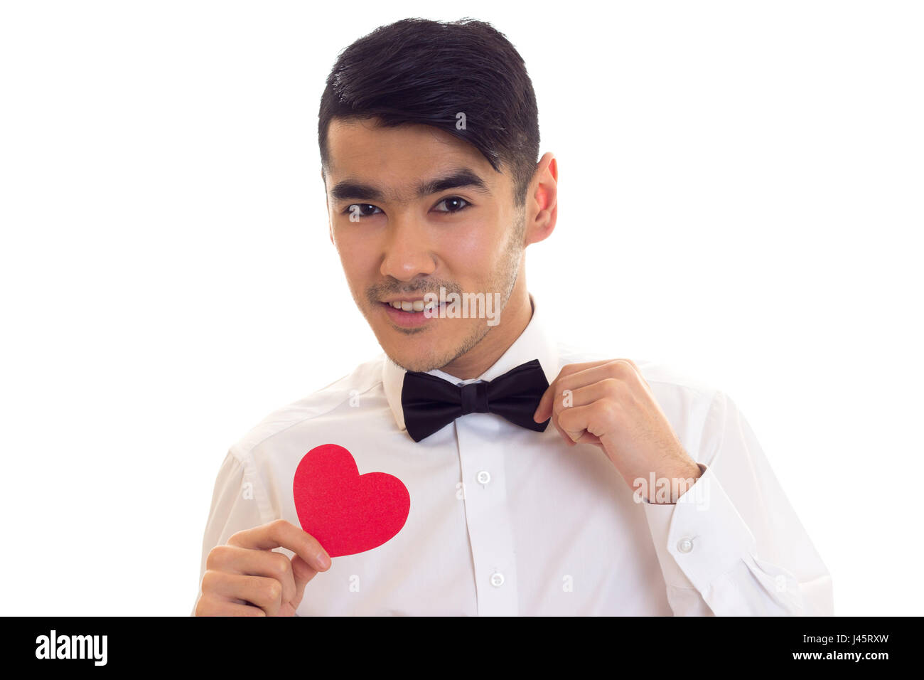 Giovane uomo in possesso di un cuore di lettura Foto Stock