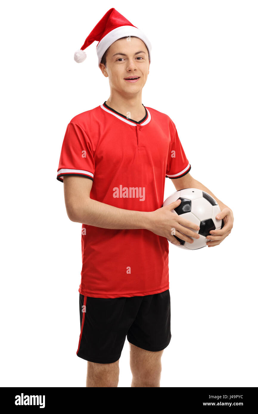 Teenage giocatore di calcio con un cappello di Natale isolato su sfondo bianco Foto Stock