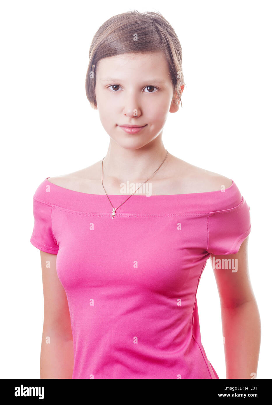 Ragazza adolescente che indossa camicetta rosa isolato su bianco Foto Stock