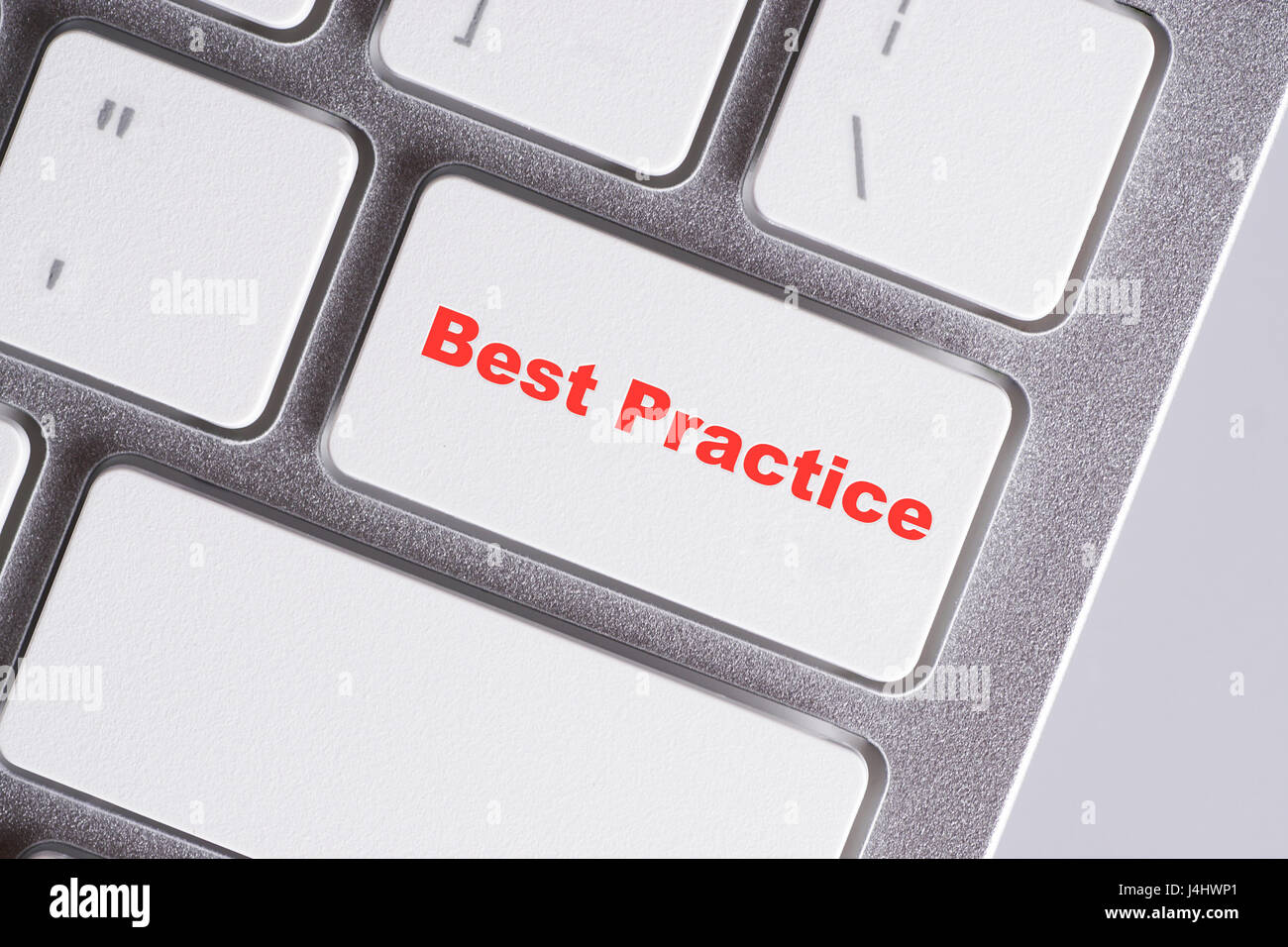 "Migliore prassi" parole di rosso su bianco tastiera - online, l'istruzione e la concezione di business Foto Stock