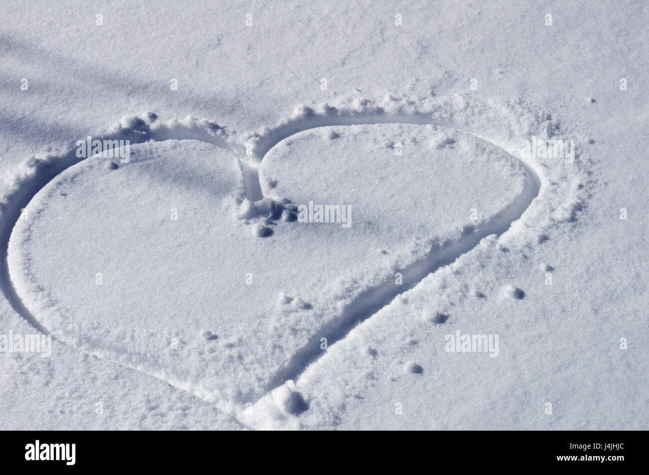 Cuore disegnato nella neve Foto Stock