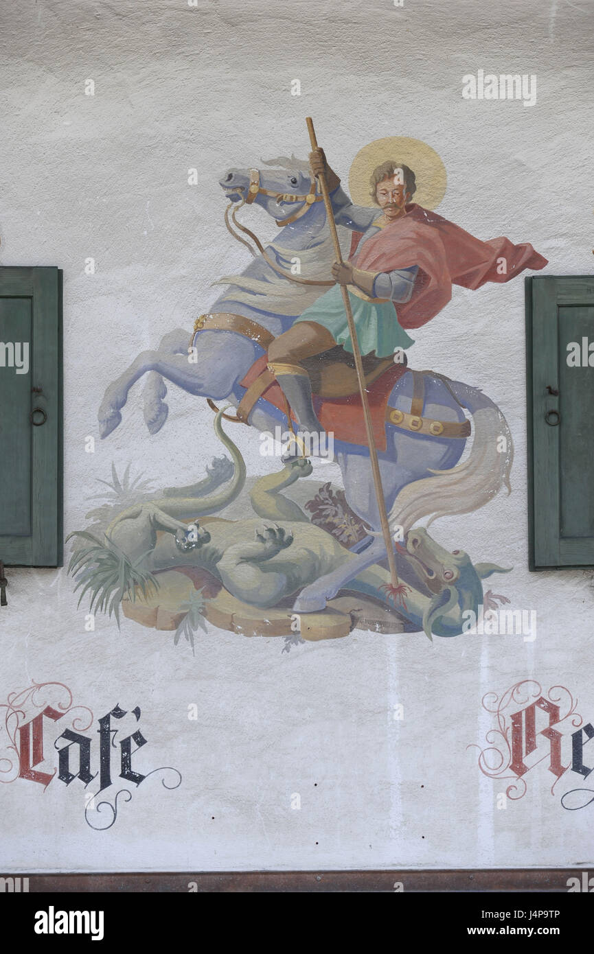 Pezzo Lüftlmalerei Georg sul cavallo combatte contro il drago cattivo sulla facciata di una casa in Schliersee, Foto Stock