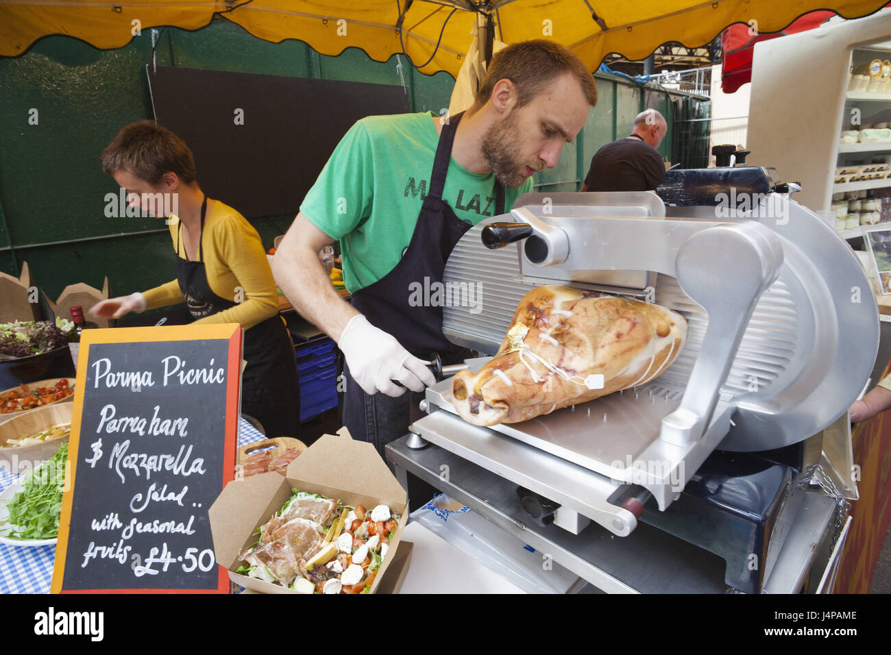 Inghilterra, Londra, Southwark, Borough Market, mercato di stallo, concessionario, prosciutto tagliato, Foto Stock