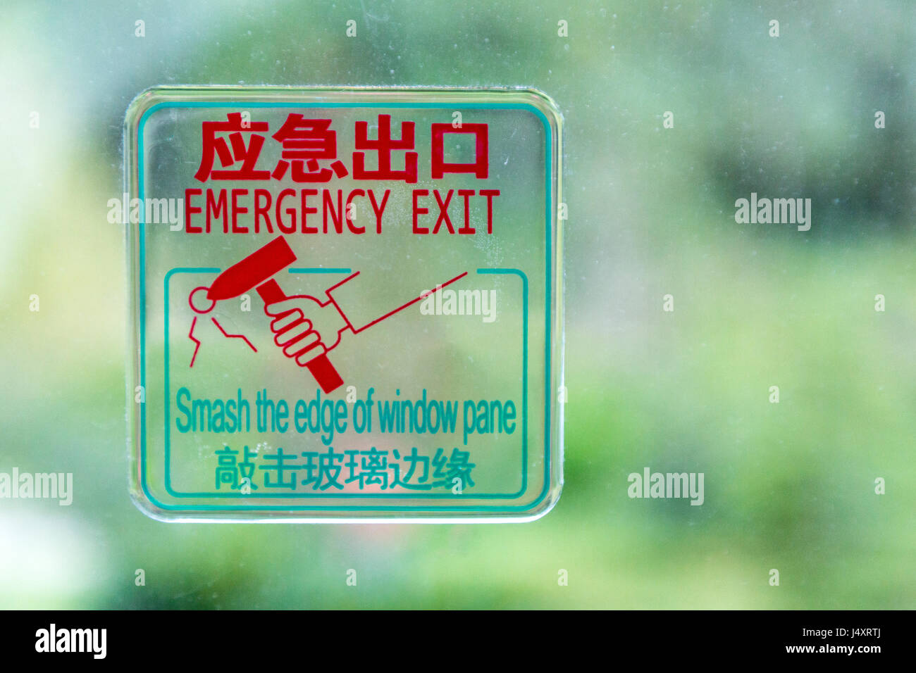 Cina. Uscita di emergenza Segno dentro Tour Bus. Foto Stock