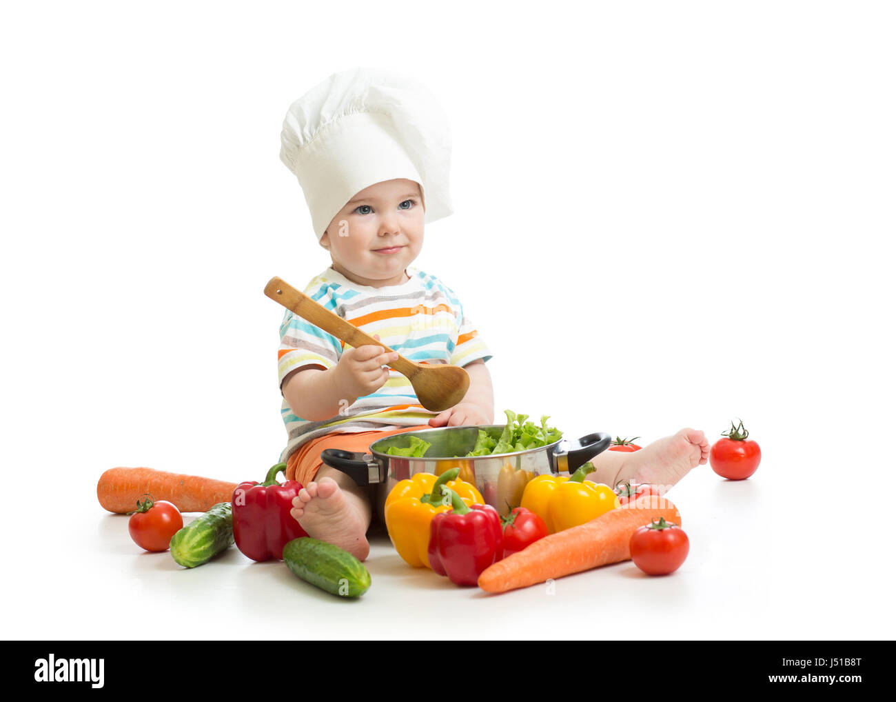 Baby chef con il cibo sano di verdure e pan Foto Stock