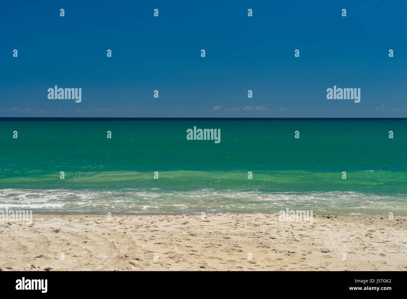 Westerly winds creare molto pulito surf con onde e acqua più chiara Foto Stock