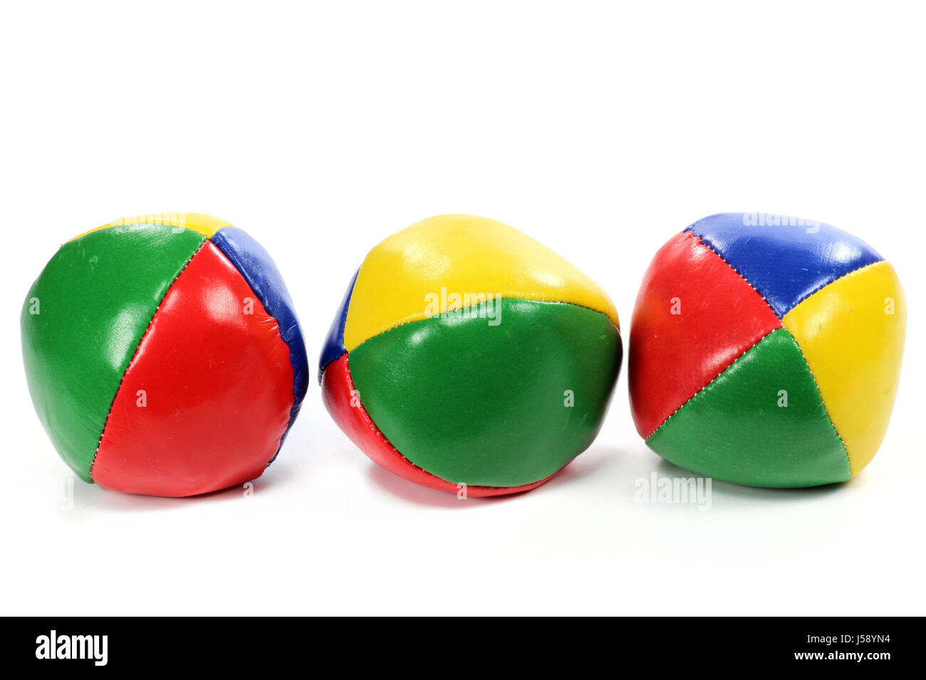 Juggling balls isolati su sfondo bianco Foto Stock