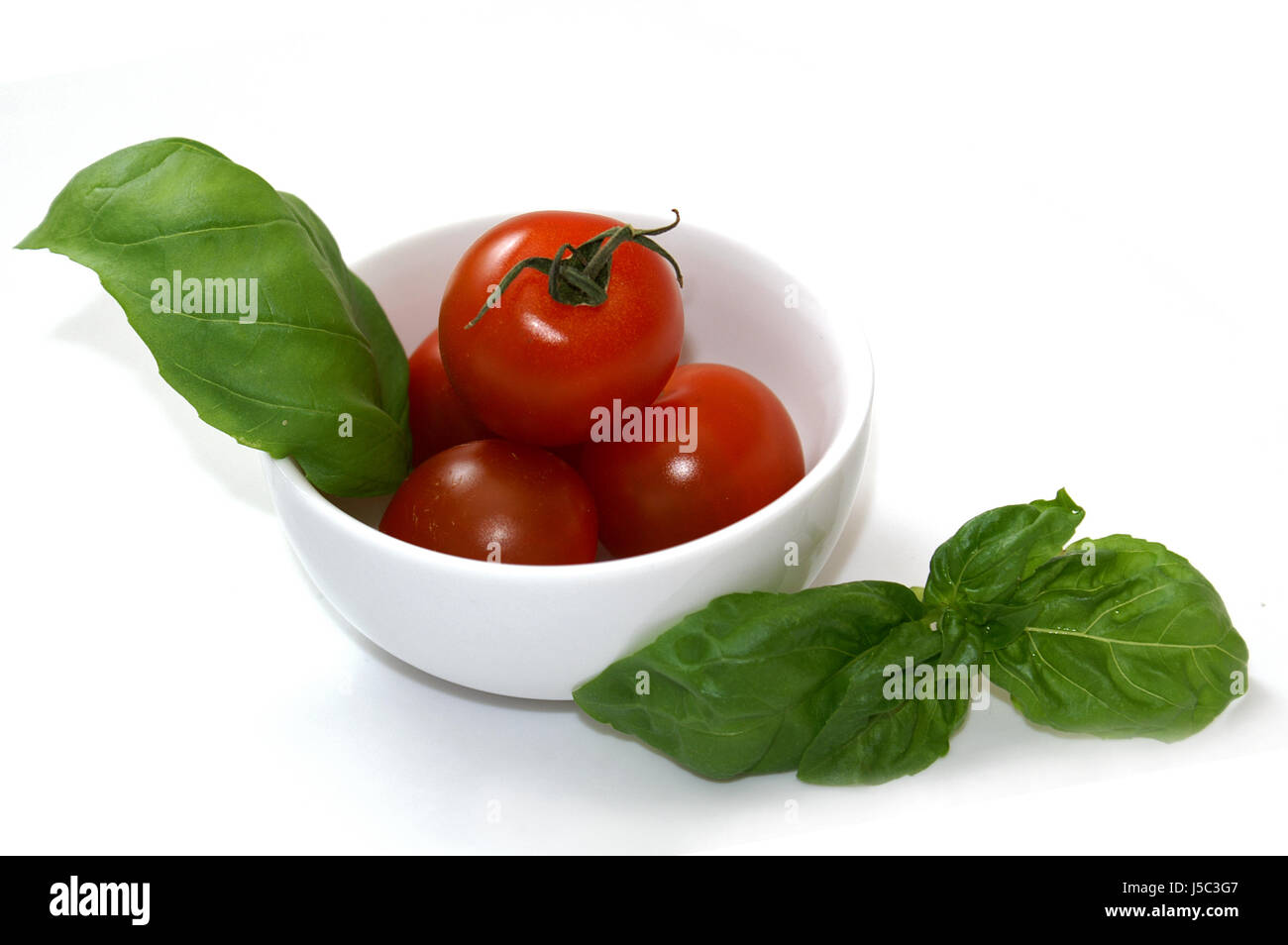 Piatto con pomodoro Foto Stock
