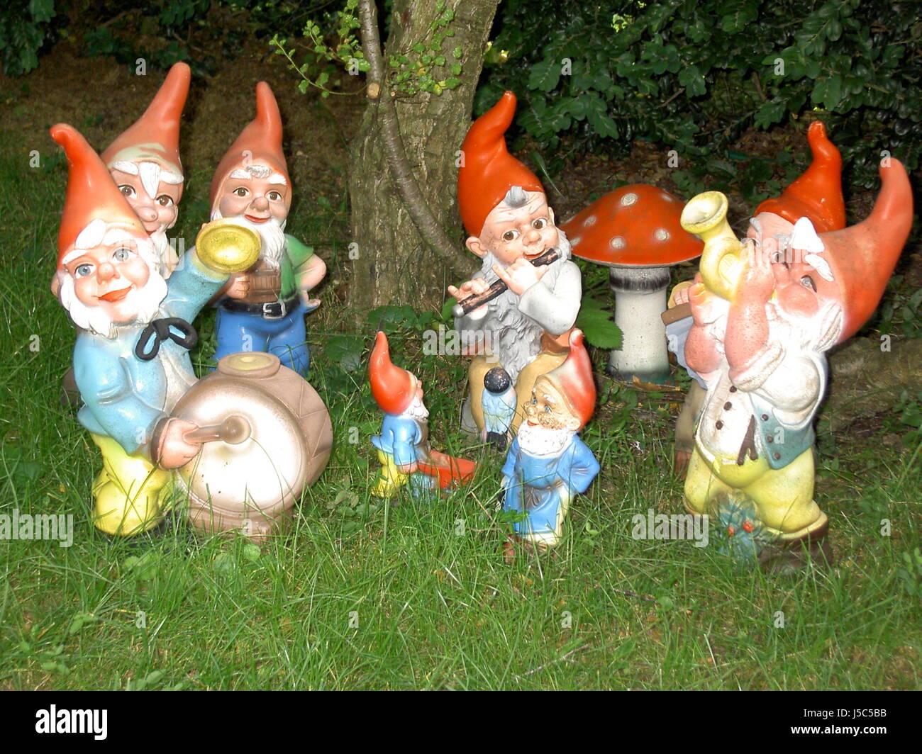 Gelatina di nana tappo sacchetto giardino nani gnome gnome musica per banda gruppo gruppo insieme Foto Stock