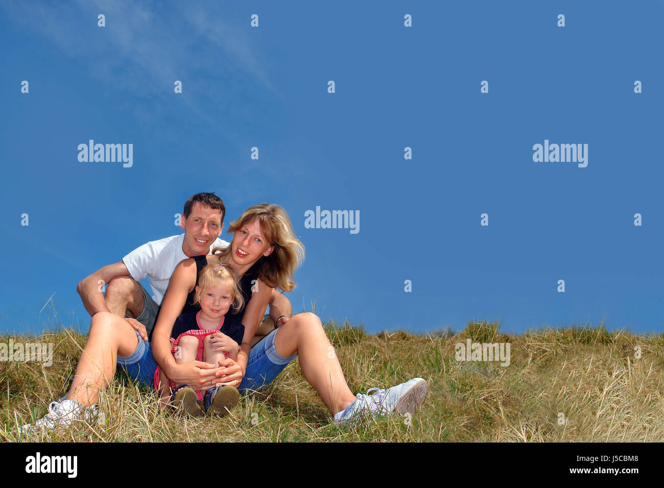 Donna blu ridere risate ridere twit risatina sorriso sorridente risate laughingly Foto Stock