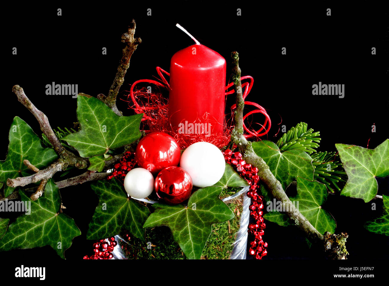 Una candela rossa di edera Foto Stock