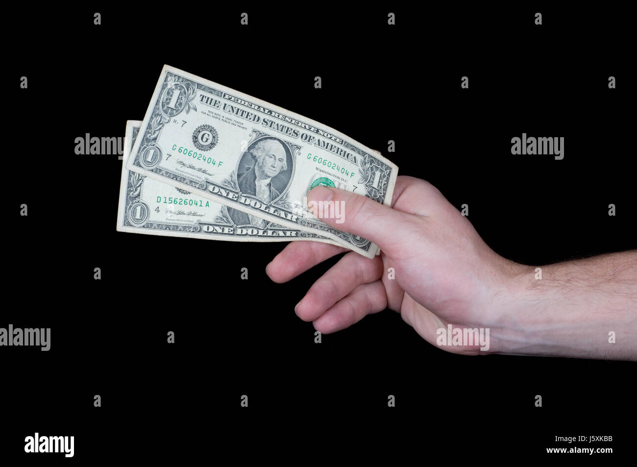 Dollari dollaro mani mano pagare denaro dollaro dollari mani mano maschile maschio Foto Stock