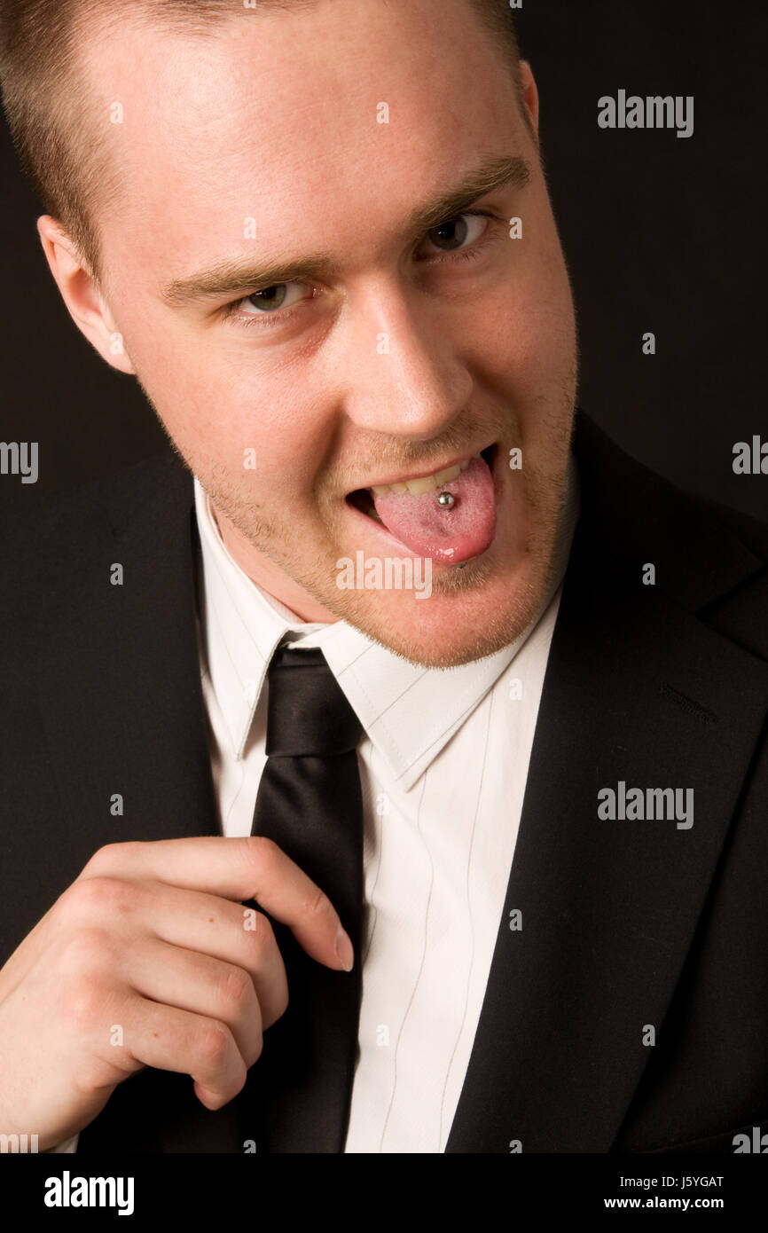Business man imprenditore uomo piercing lingua ridere risate ridere twit  risatina Foto stock - Alamy
