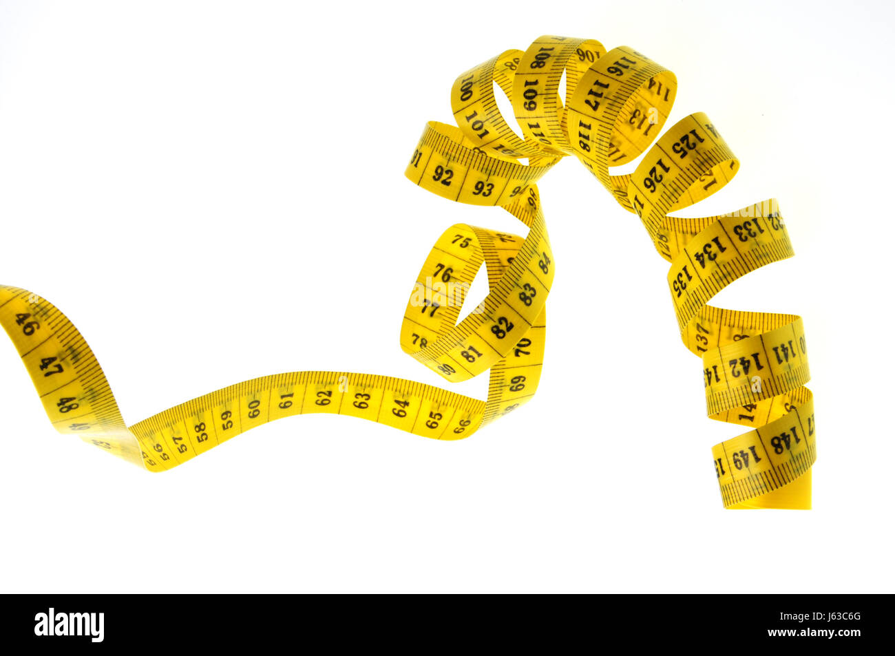 Esentati nastro giallo come misura di una spirale Foto Stock