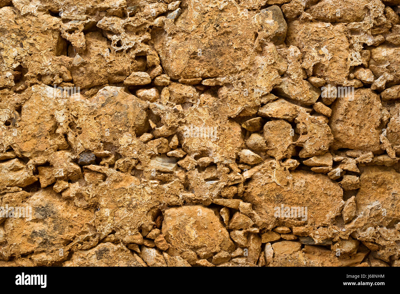 La texture di pietra-parete di argilla nel Castello Fortezza Rethimno - fortezza costruita dai veneziani, sulla collina Paleokastro. Creta, Grecia Foto Stock