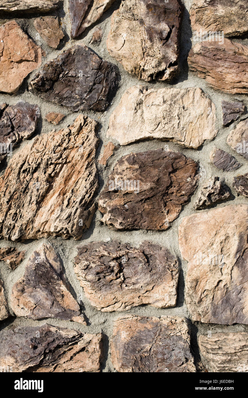 Stone parete di roccia sullo sfondo di pattern texture di sfondo dettaglio grande enorme di grandi dimensioni Foto Stock