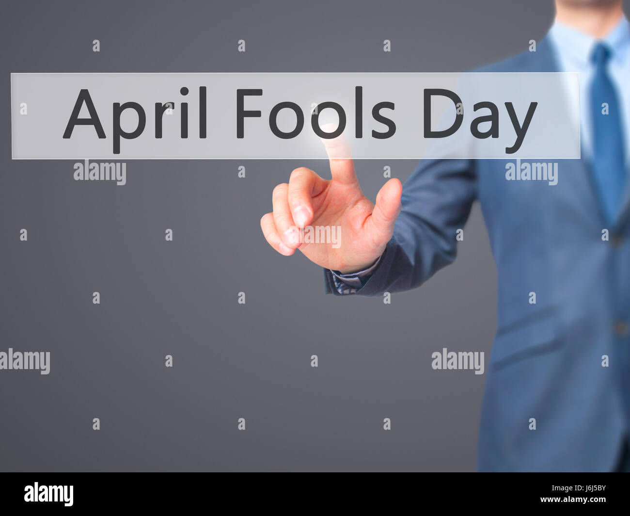 April Fools Day - Imprenditore premere sul display digitale. Business, internet concetto. Stock Photo Foto Stock