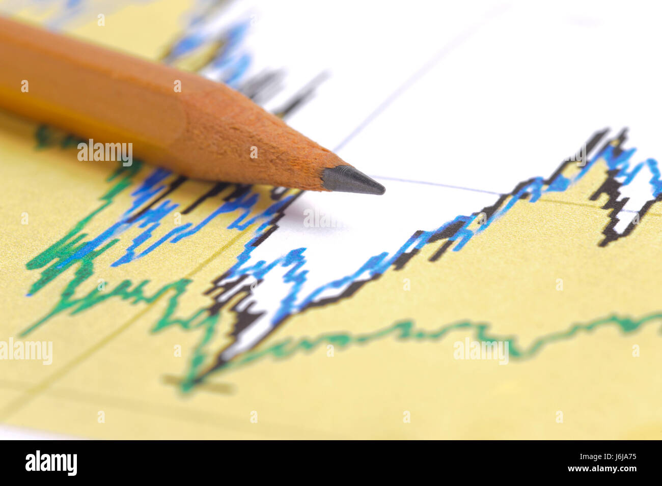 Tabella finanziaria e matita illustra il successo di mercato di exchange Foto Stock