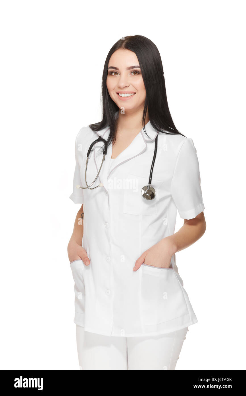 Bella infermiera con uno stetoscopio attorno al collo tenendo le mani nelle  tasche Foto stock - Alamy