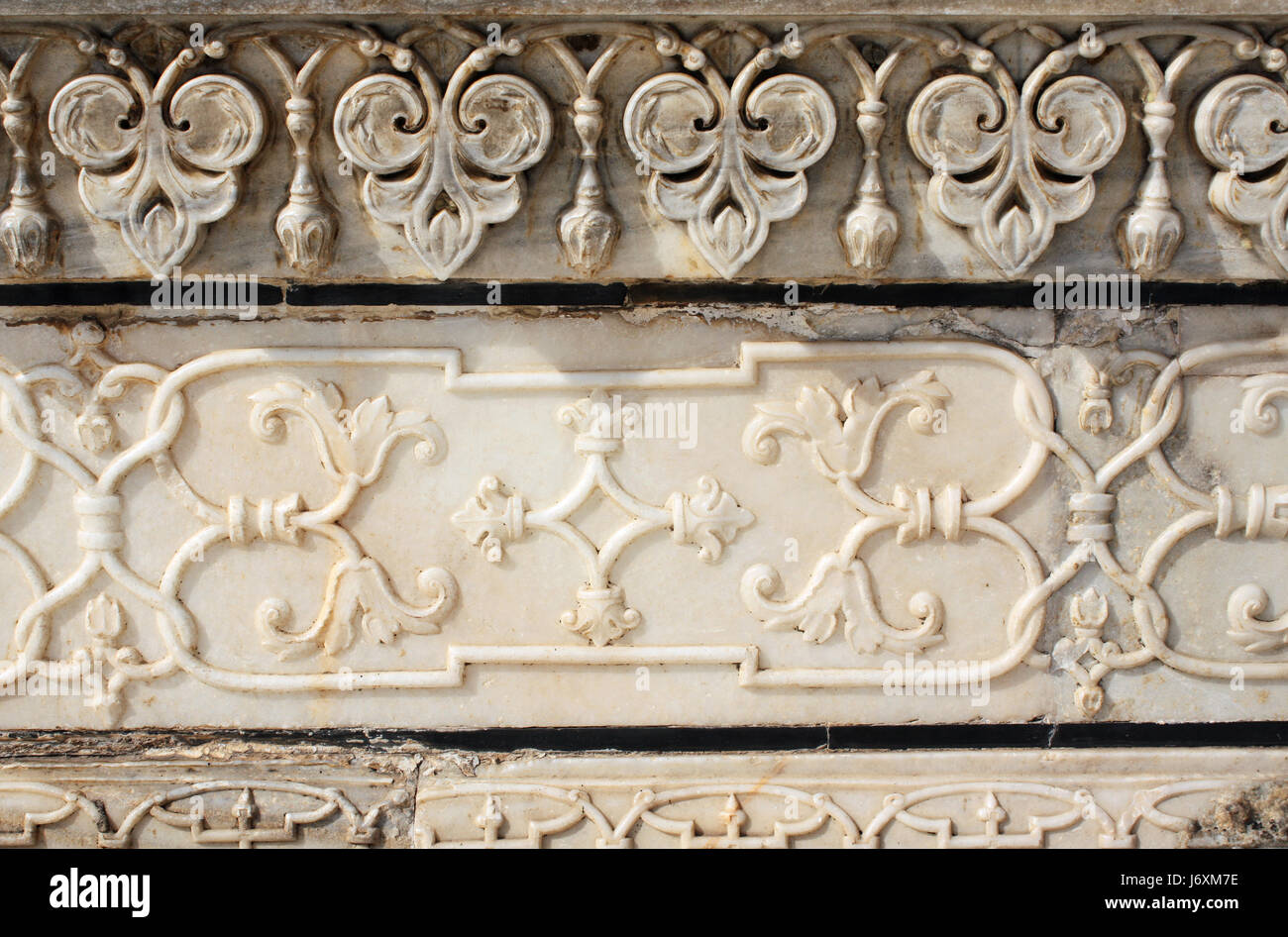 Antico Fiore scolpito nel marmo in Taj Mahal mausoleo, Agra, India Foto Stock