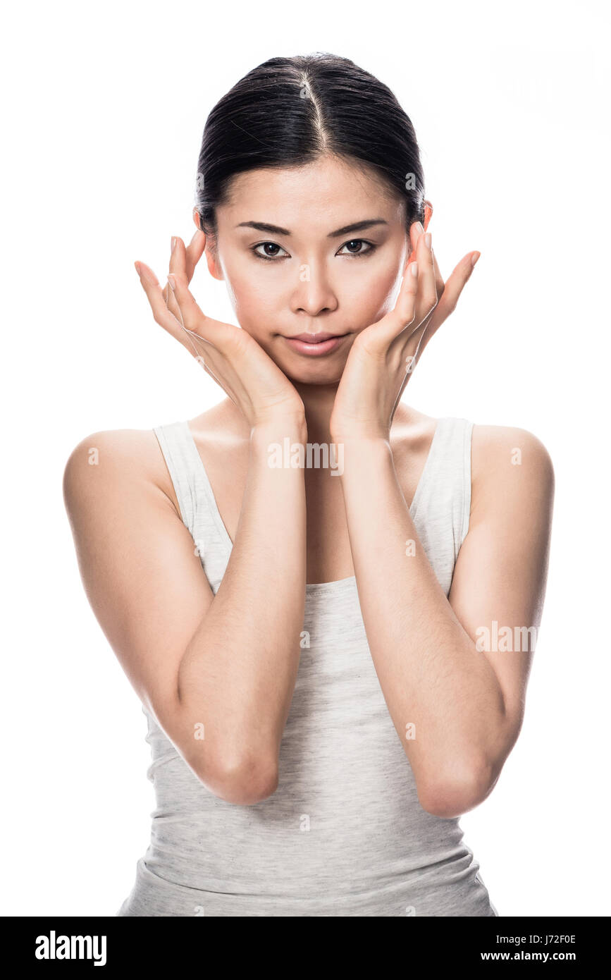 Ritratto di Asian giovane donna che guarda la fotocamera Foto Stock