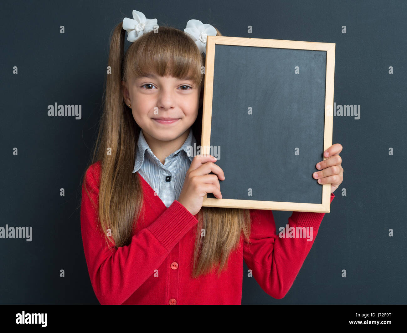 La ragazza si torna a scuola Foto Stock