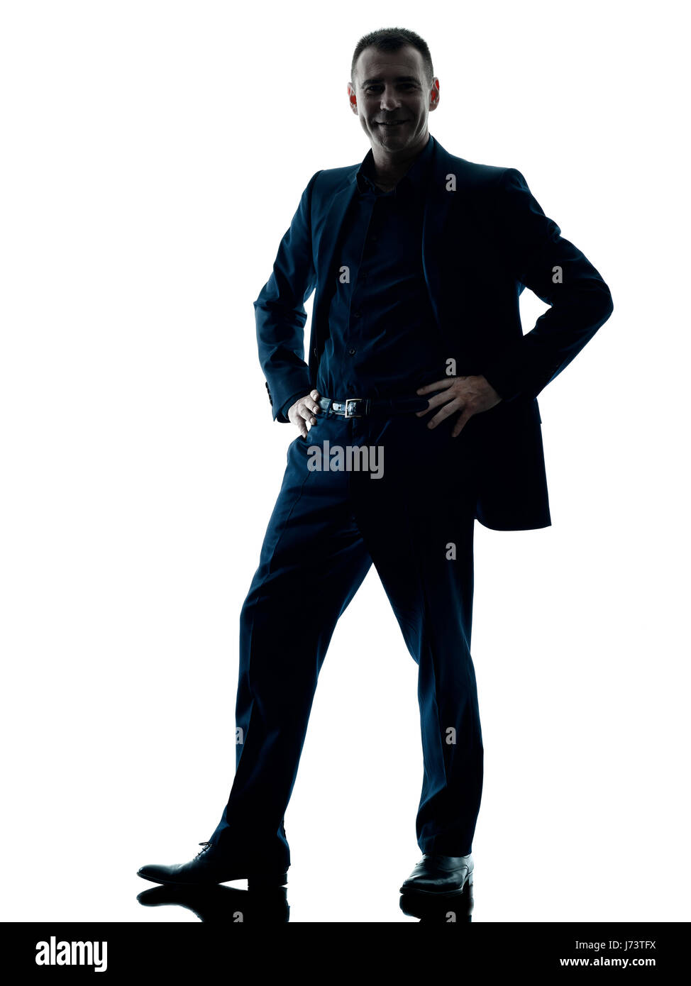 Un caucasian business man standing silhouette sorridente isolati su sfondo bianco Foto Stock