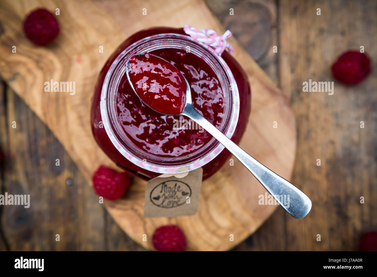 Cucchiaio di confettura di lamponi Foto Stock