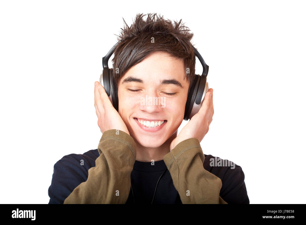 Adolescente ascoltare musica con le cuffie Foto stock - Alamy